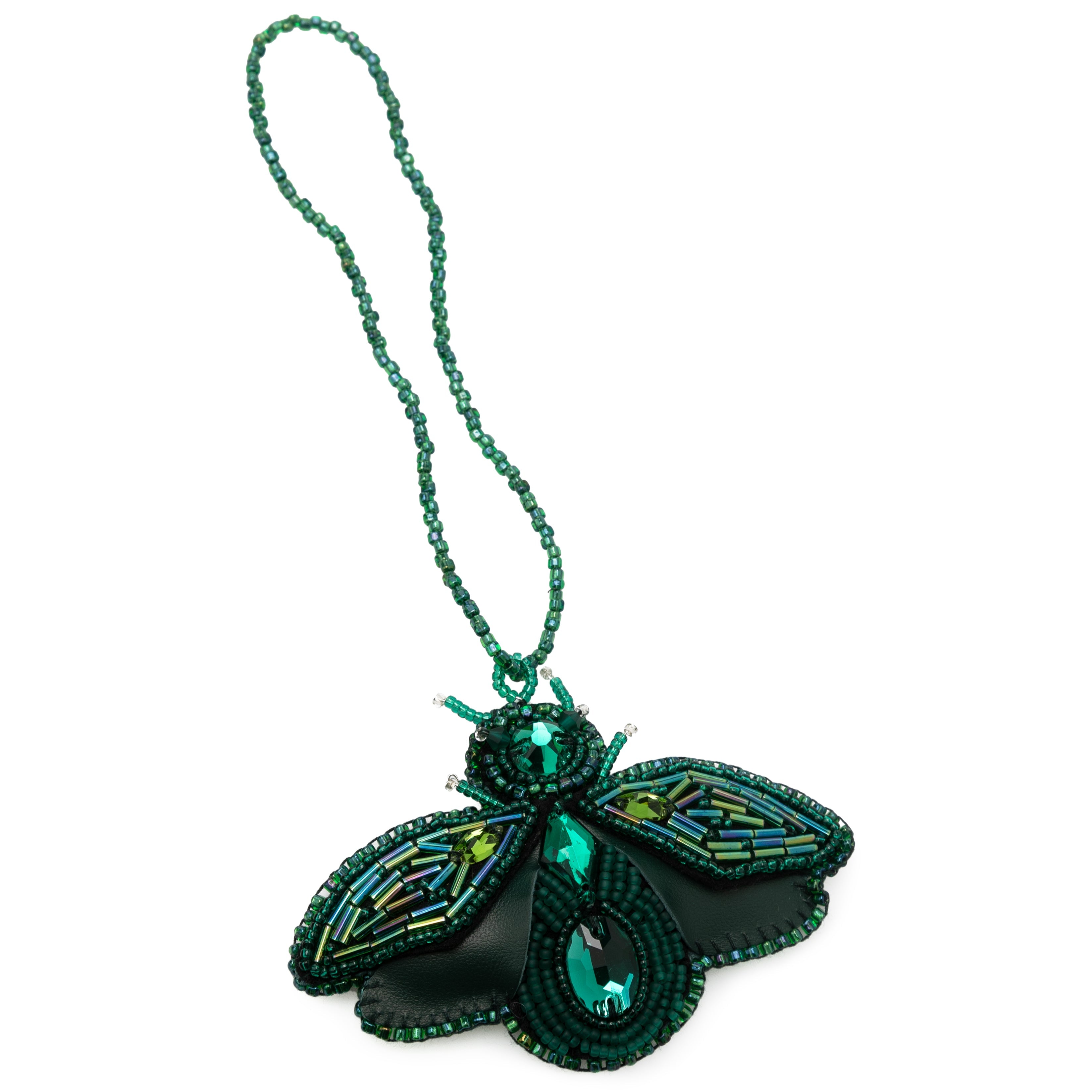 Green bag charm made from high-quality leather, featuring plastic bead embellishments and a signature logo on the back. Handcrafted in Portugal, this 6.5 cm x 9 cm keychain adds a sophisticated touch to any bag or keys.