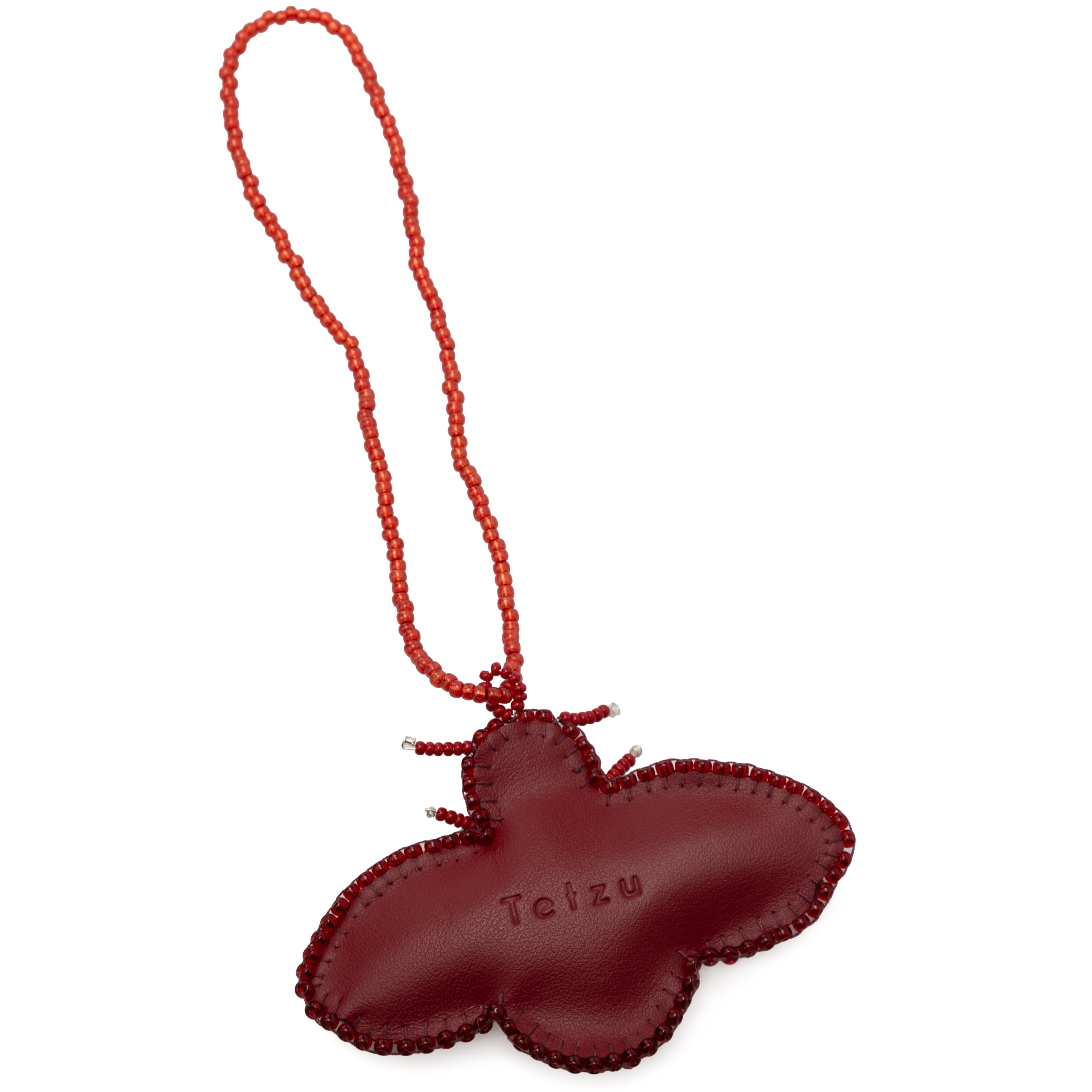 Cherry Red bag charm made from high-quality leather, featuring plastic bead embellishments and a signature logo on the back. Handcrafted in Portugal, this 6.5 cm x 9 cm keychain adds a sophisticated touch to any bag or keys.